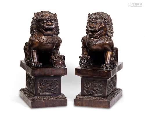 A PAIR OF CARVED COPPER LIONS