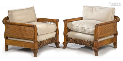 Pair of armchairs in carved beech, with mesh backr…