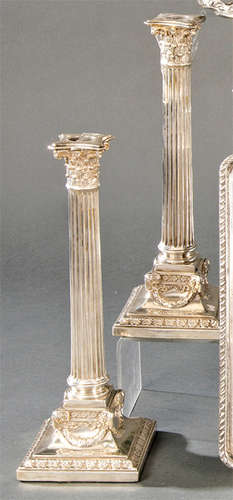 Pair of English silver candlesticks punched Sterli…