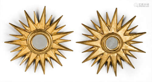 Pair of sun mirrors in stucco and gold wood.