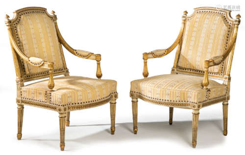 Pair of Louis XVI armchairs in carved wood and lac…