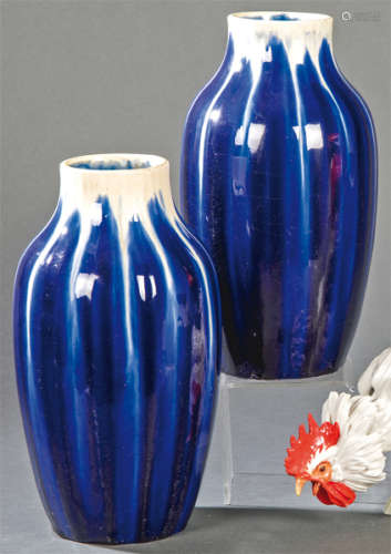 Pair of blue and white enameled earthenware vases.