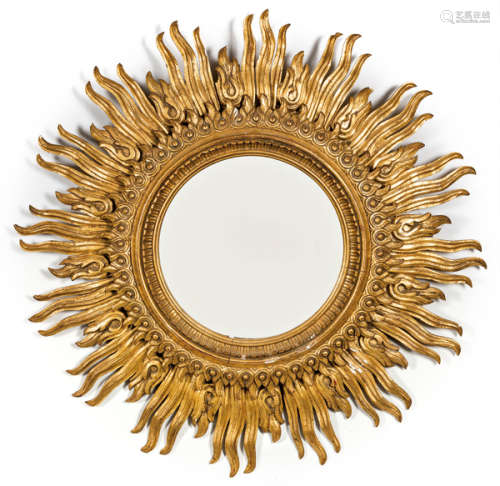 Sun mirror in carved and gilded wood, with concent…