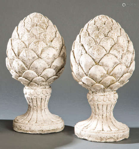 Pair of garden pineapples in stone conglomerate.