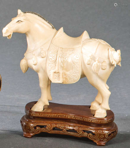 Horse carved in ivory with touches of black