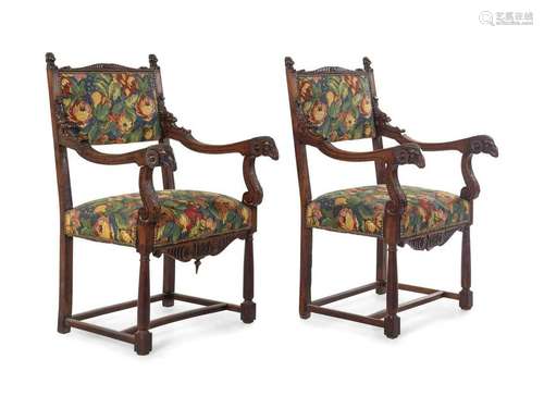 A Pair of Empire Style Carved Walnut Fauteuils