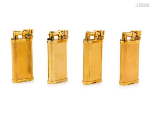 A Group of Four Gilt Metal Dunhill Lift-Arm Lighters