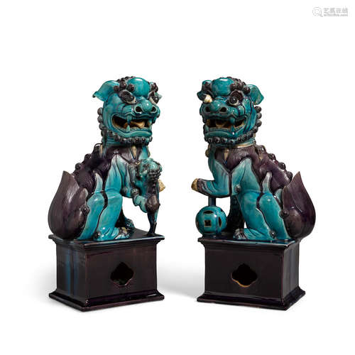 Qing dynasty, 19th century A Pair of Turquoise and Aubergine-Glazed Buddhistic Lions