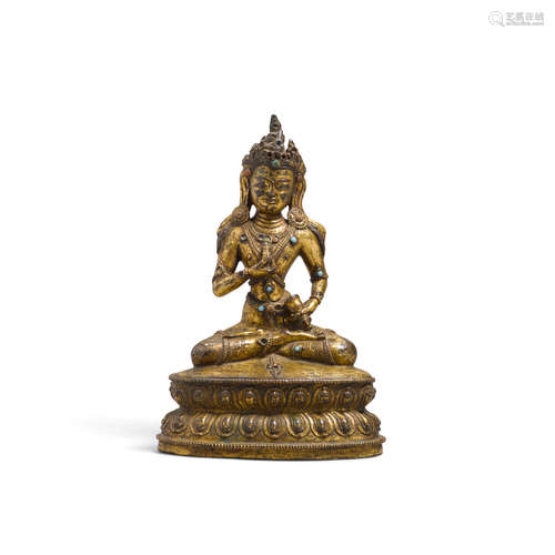 Tibet, circa 16th century A seated gilt metal alloy figure of Vajrasattva