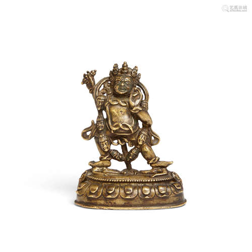 Circa 14th century A gilt bronze figure of Vajrapani