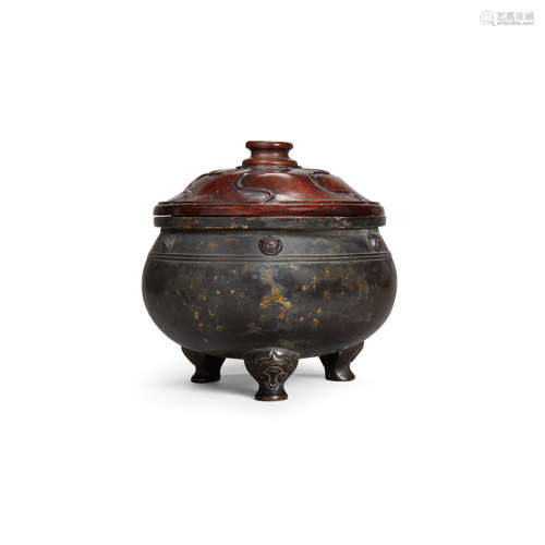 Xuande mark, 17th/18th century A gilt-splashed bronze tripod incense burner