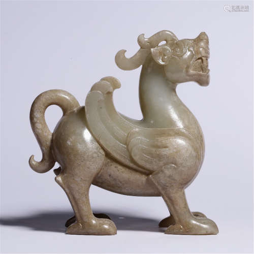 A CHINESE WHITE JADE BEAST TABLE ITEM