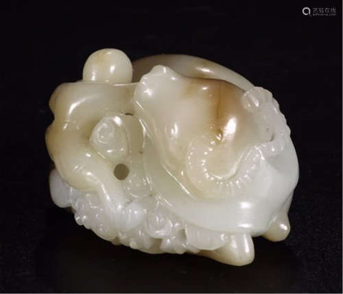 A CHINESE CARVED WHITE JADE OX AND BOY TABLE ITEM