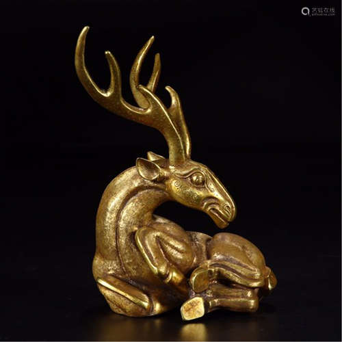 A CHINESE CARVED GILT BRONZE DEER TABLE ITEM