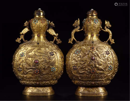 A PAIR OF CHINESE CARVED GILT BRONZE LIDDED DRAGON PHOENIX VASES
