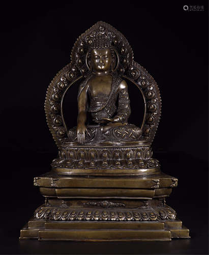 A CHINESE GILT BRONZE SEATED SAKAYMUNI