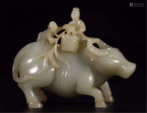 A CHINESE CARVED WHITE JADE OX AND BOY TABLE ITEM