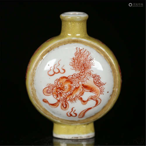 A CHINESE PORCELAIN RED LION PLAYING BALL KETTLE