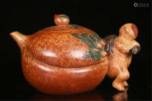 A CHINESE CARVED ZISHA CLAY PEACH TEA POT