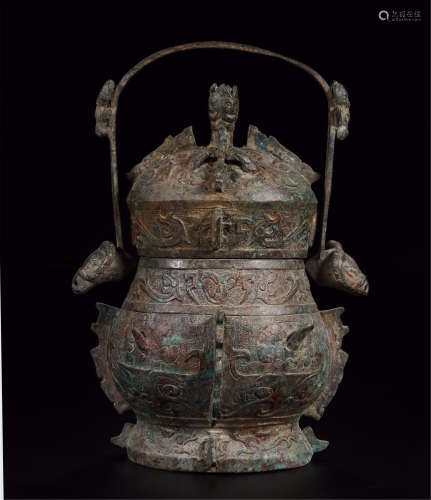 A CHINESE BRONZE LONG HANGLE KETTLE