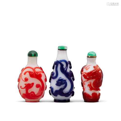 Late 18th/19th century Three overlay decorated glass 'dragon' snuff bottles