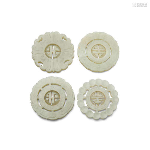 Four circular jade pendants