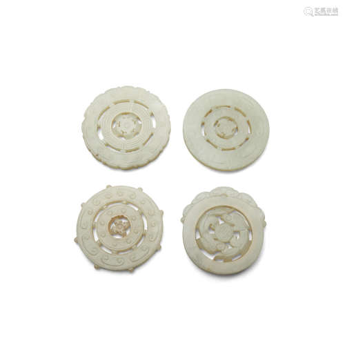 Four circular jade pendants