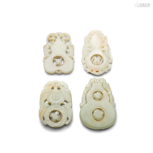 Four jade double-gourd form pendants