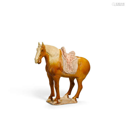 Tang dynasty A straw and ochre-glazed pottery saddled horse