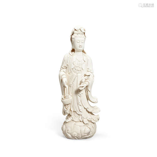 A DEHUA FIGURE OF THE FISH BASKET GUANYIN