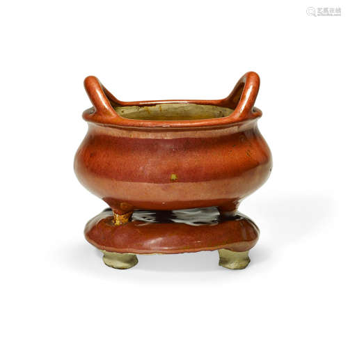 Late Qing/Republic period A red glazed earthenware censer and base