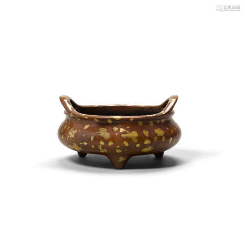 Xuande mark, 20th century A gilt-splashed bronze tripod incense burner