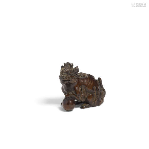 Qing dynasty A small patinated bronze scroll weight