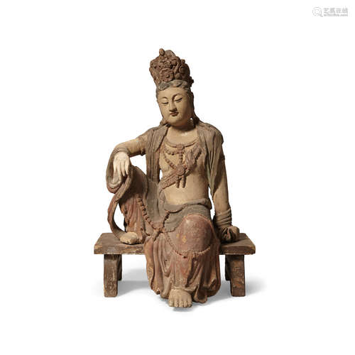 A carved wood seated Guanyin