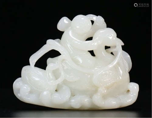 A CHINESE CARVED JADE BOY AND GOOSE TABLE ITEM