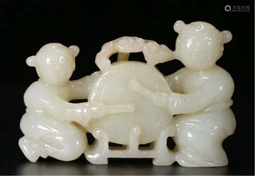 A CHINESE CARVED JADE BOY PLAYING DRUM TABLE ITEM