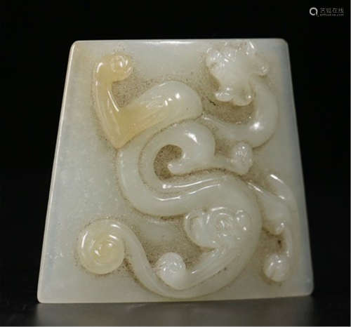 A CHINESECARVED JADE DRAGON PENDANT