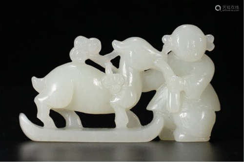 A CHINESE CARVED JADE BOY PLAYING WITH DEER TABLE ITEM