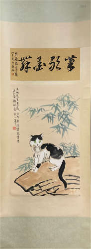 A CHINESE SCROLL PAINTING OF CAT ON ROCK WITH CALLIGRAPHY