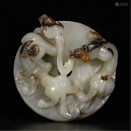 A CHINESE CARVED JADE DRAGON PENDANT