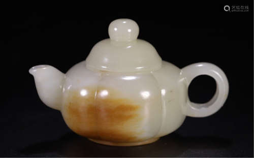 A CHINESE CARVED JADE YIXING TEA POT