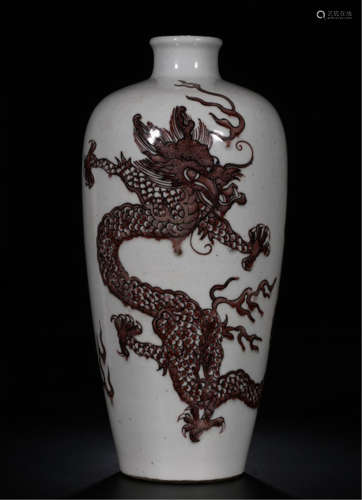 A CHINESE PORCELAIN RED GALZED DRAGON VASE