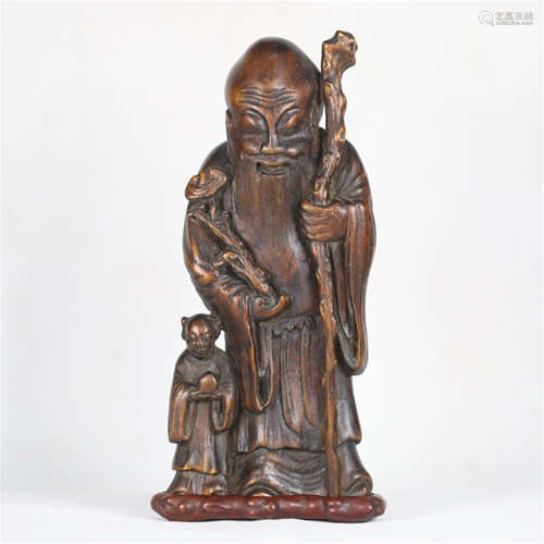 A CHINESE CARVED ANCIENT AGALWOOD OLD MAN TABLE ITEM