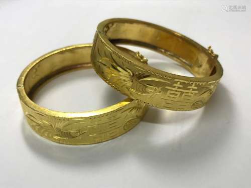 CHINE XXe siècle. Paire de bracelets rigides en or…