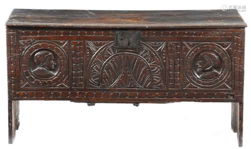 A 17th century oak coffer, the hinged lid with mou…