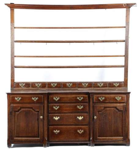 A George III oak dresser, the raised plate rack wi…