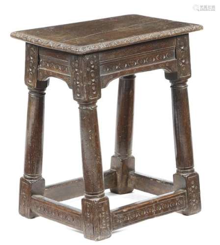 An oak joint stool, the seat with a carved edge, t…