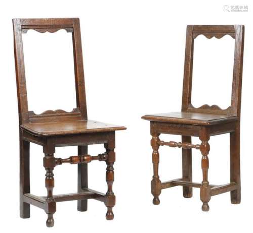 Two similar early 18th century oak backstools, eac…