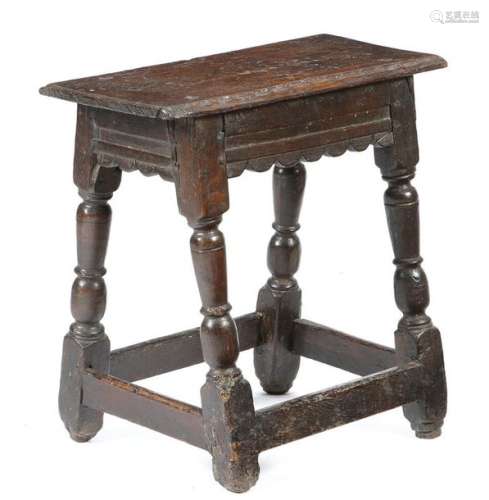 A mid 17th century oak joint stool, the top with t…