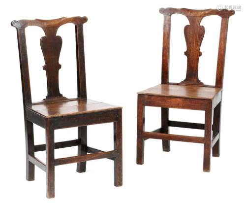 A pair of George II country oak side chairs, each …